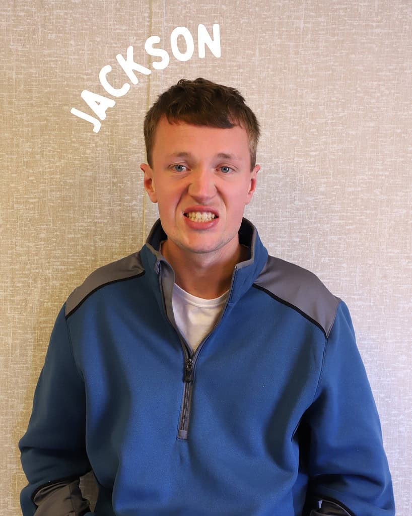 Jackson smiling at Riverside Coffee Shop, promoting a welcoming environment for ABA programs.