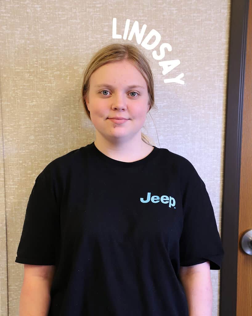 Young girl with blonde hair in a black Jeep t-shirt at Riverside Coffee Shop.