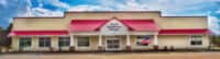 Riverside Coffee Shop building with red awning and welcoming entrance.
